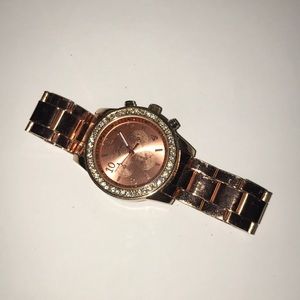 Unworn rose gold diamond studded watch